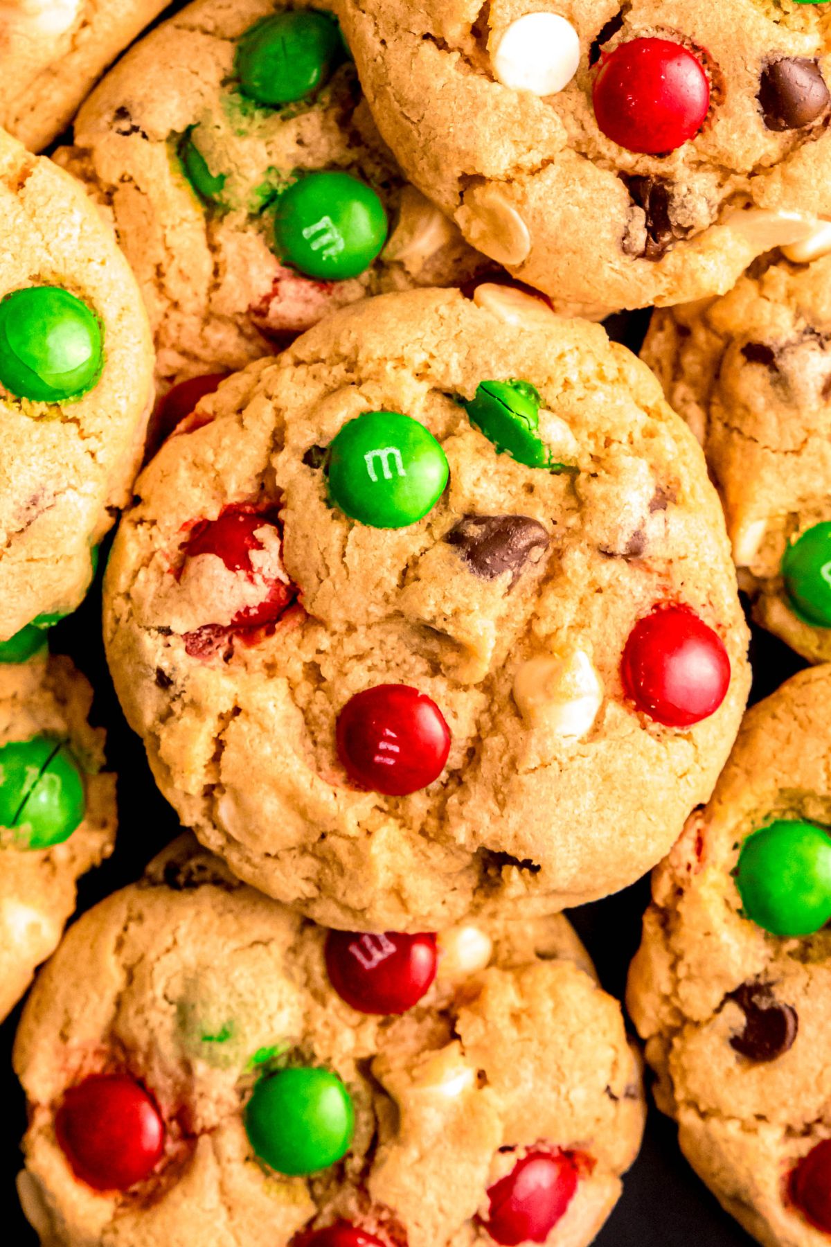 closeup overhead shot of a pile of loaded Christmas chocolate chip cookies.