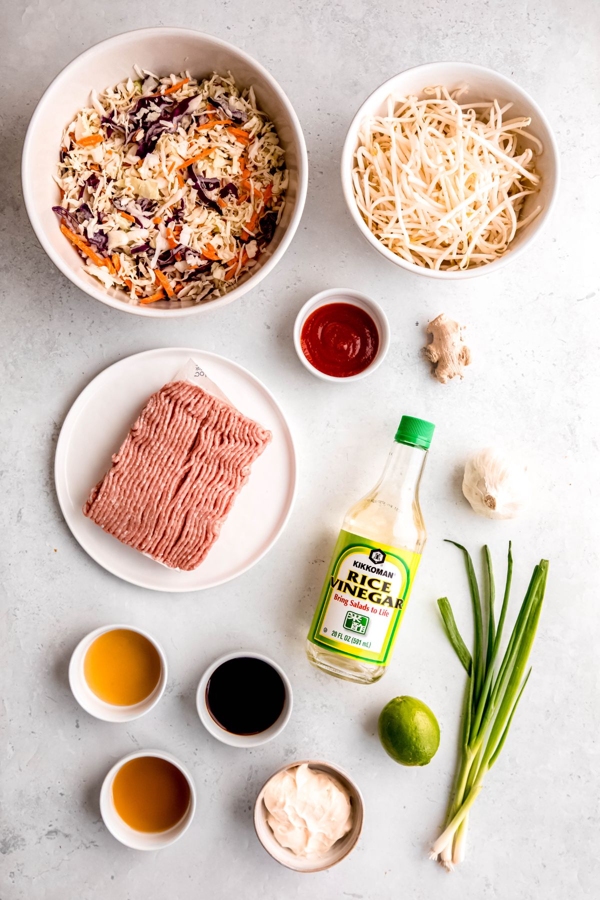 All the ingredients for egg roll in a bowl on the counter.