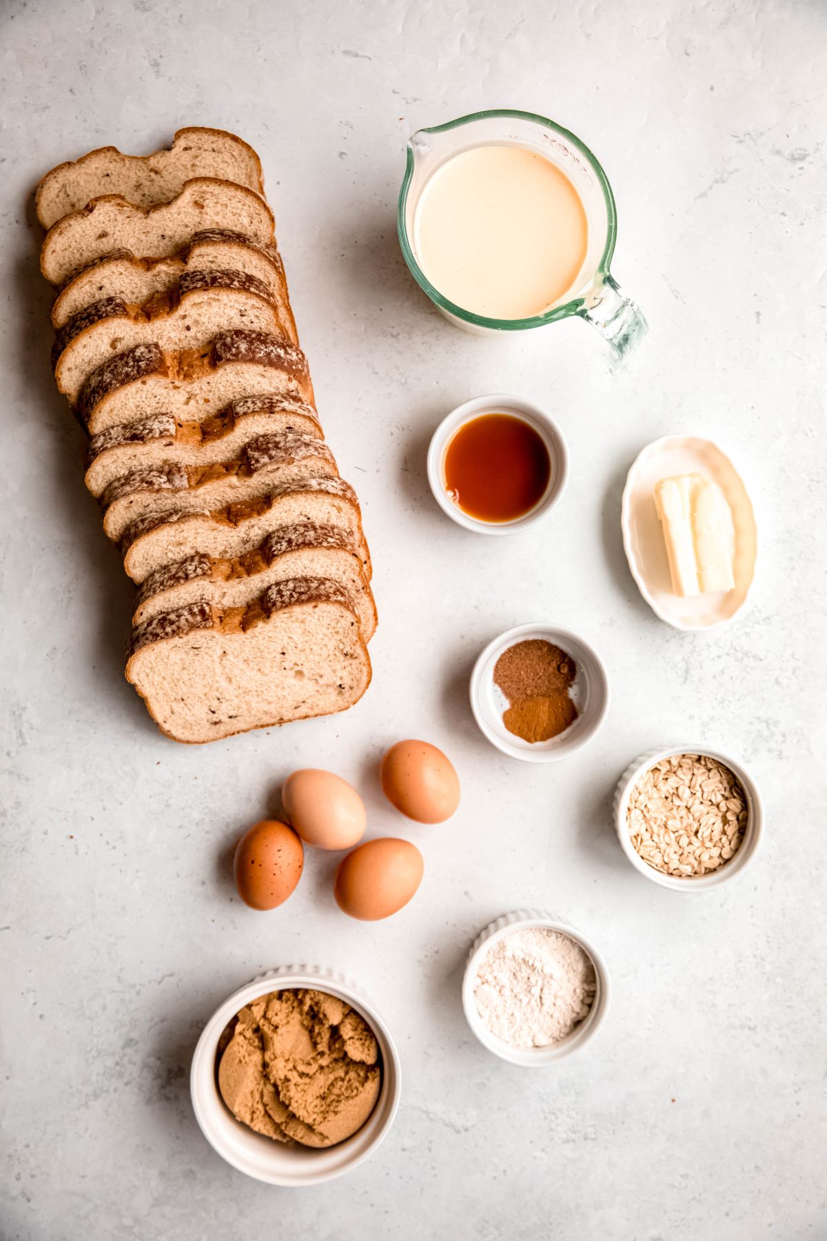 All the ingredients need to make eggnog French toast casserole on the counter.