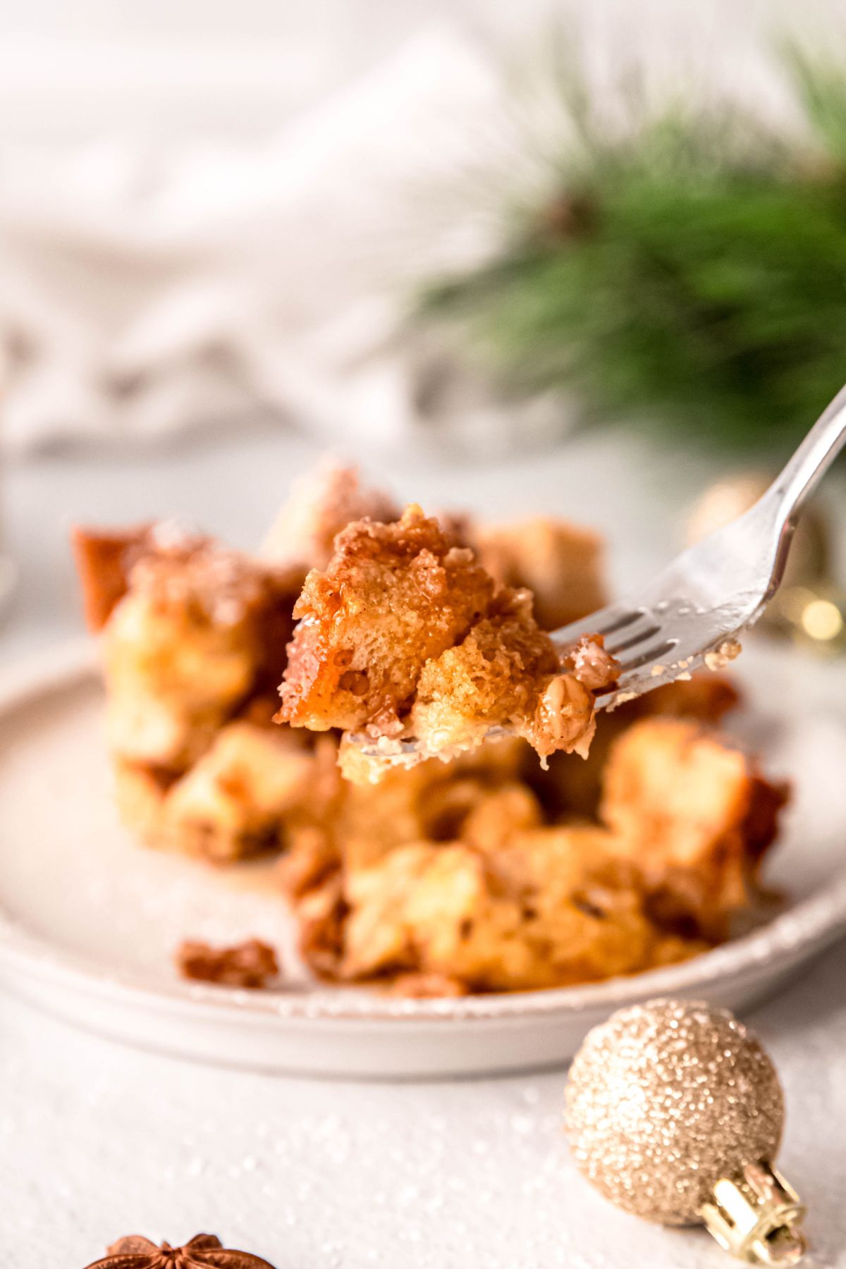A close-up shot of a forkful of the eggnog French toast casserole.