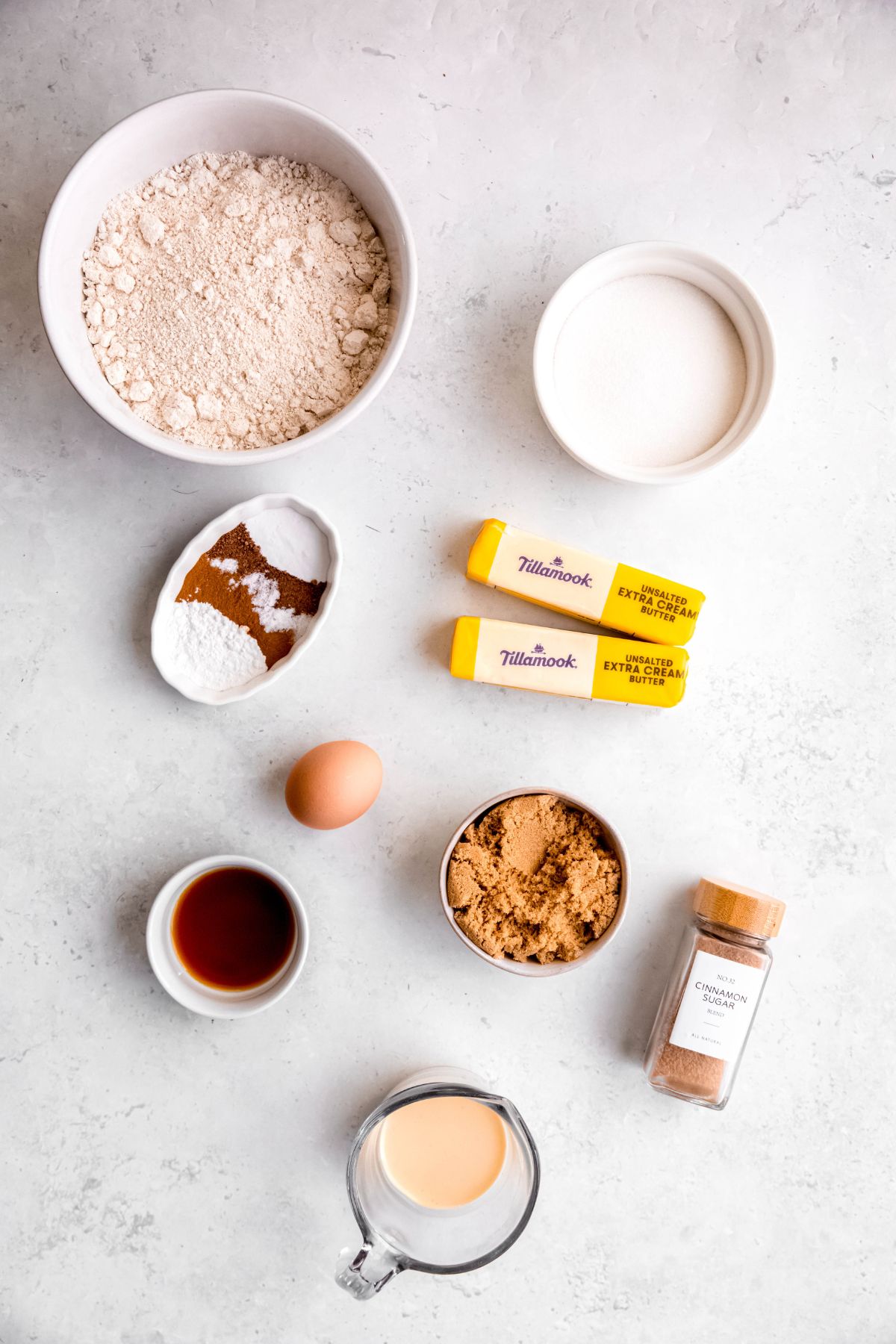 ingredients for making whole wheat eggnog snickerdoodles recipe measured out on a white table.