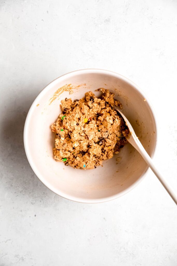 protein cookie dough mixture after stirring together with a wooden spoon.