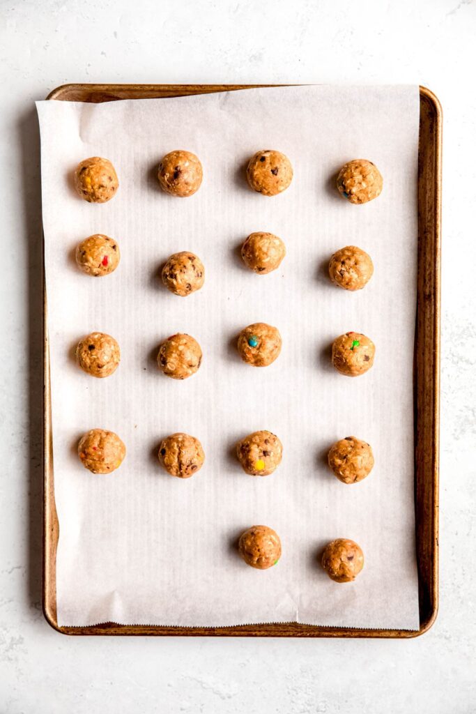 18 monster energy bites after rolling into balls and refrigerating on a baking sheet.
