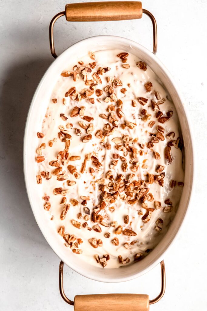 protein pumpkin baked oatmeal after baking and adding the glaze and pecan garnish.