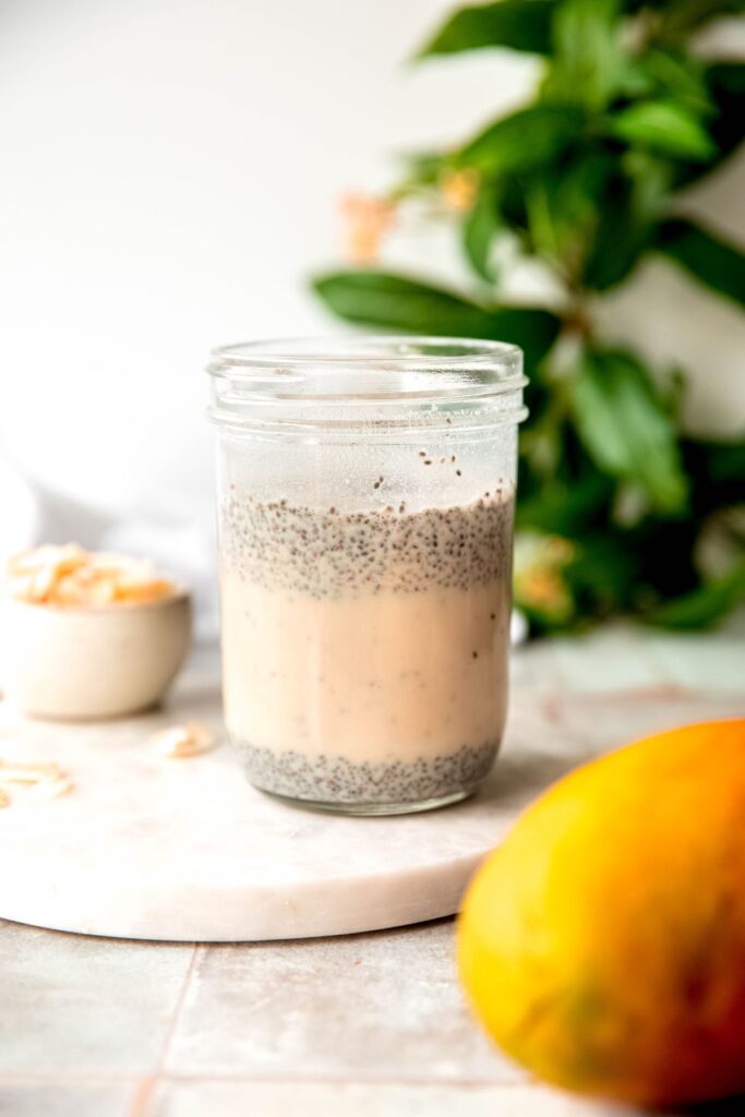 the chia seeds have floated to the top and bottom of the jar, leaving a band of mostly protein milk in the center; this is a good time to stir a second time before refrigerating.