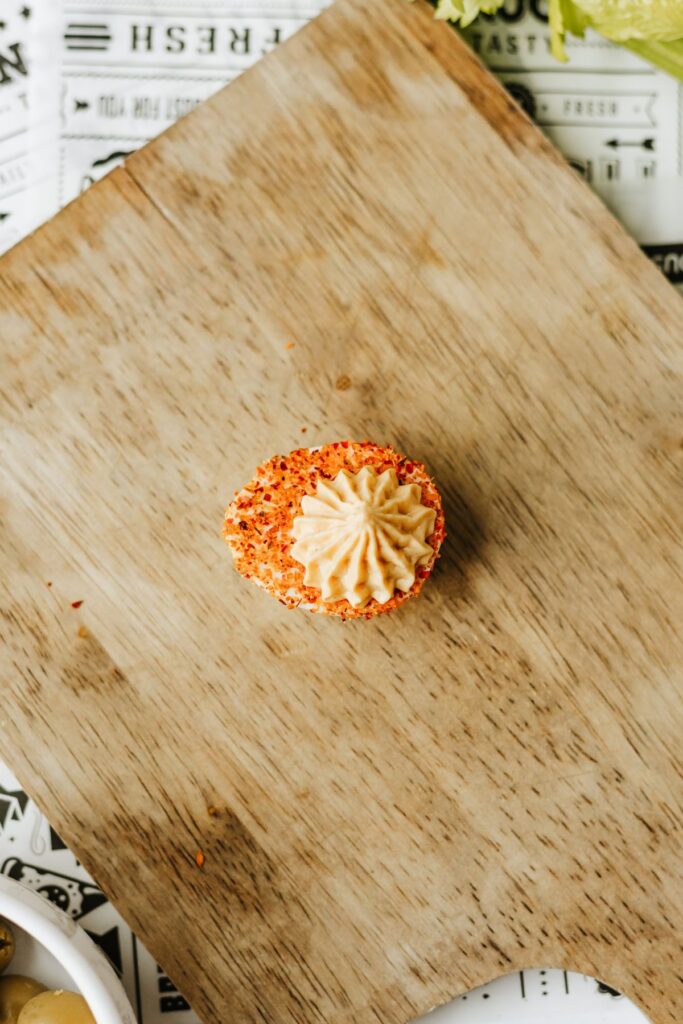tajin-dipped egg white after piping in the filling.