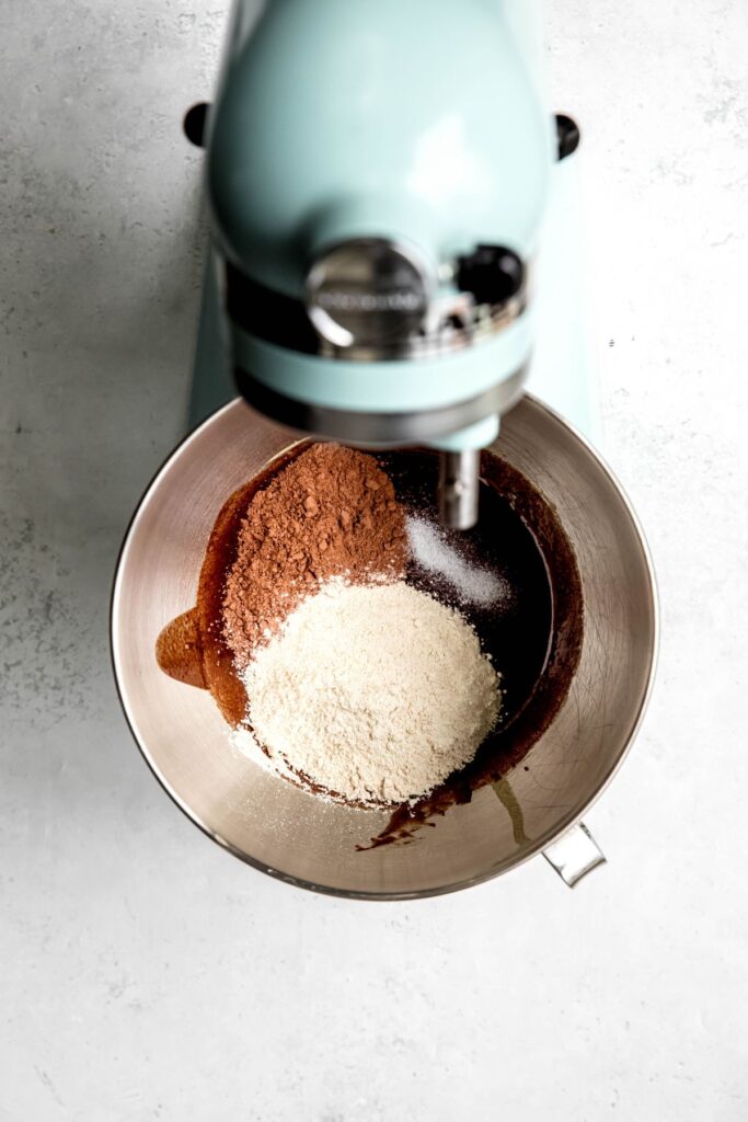 dry ingredients added to the mixing bowl with the brownie batter.