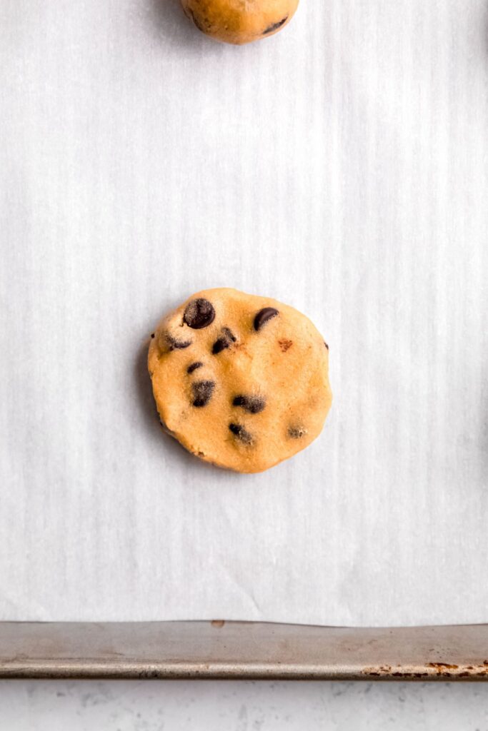 cookie dough round after being flattened.