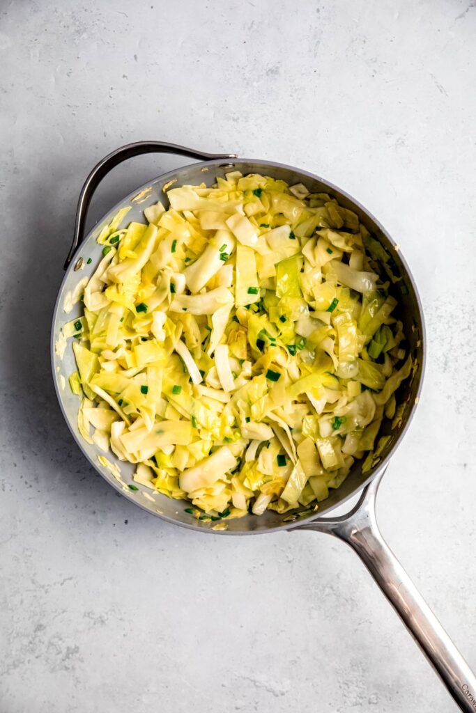 Sautéed cabbage in a skillet.