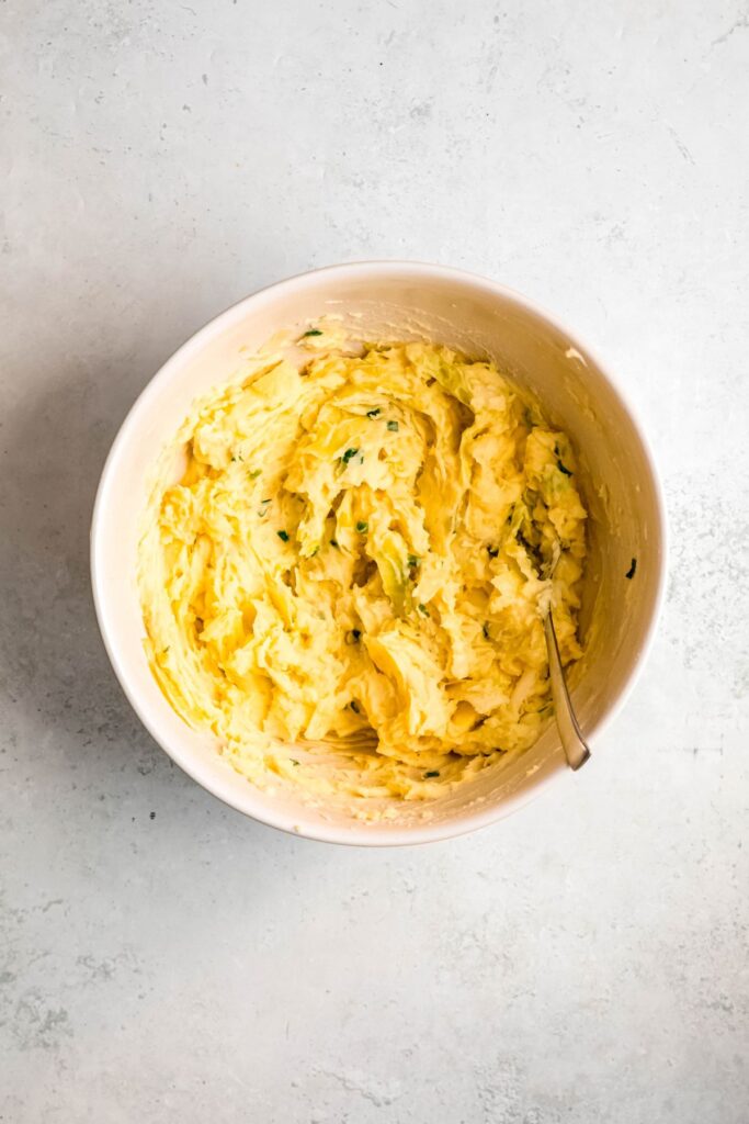 Freshly made colcannon in a mixing bowl, ready to serve.