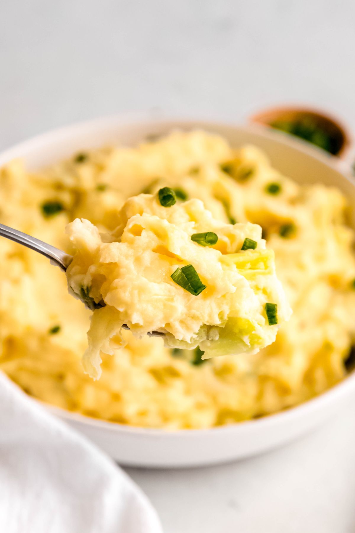 An up-close shot of a spoonful of colcannon.