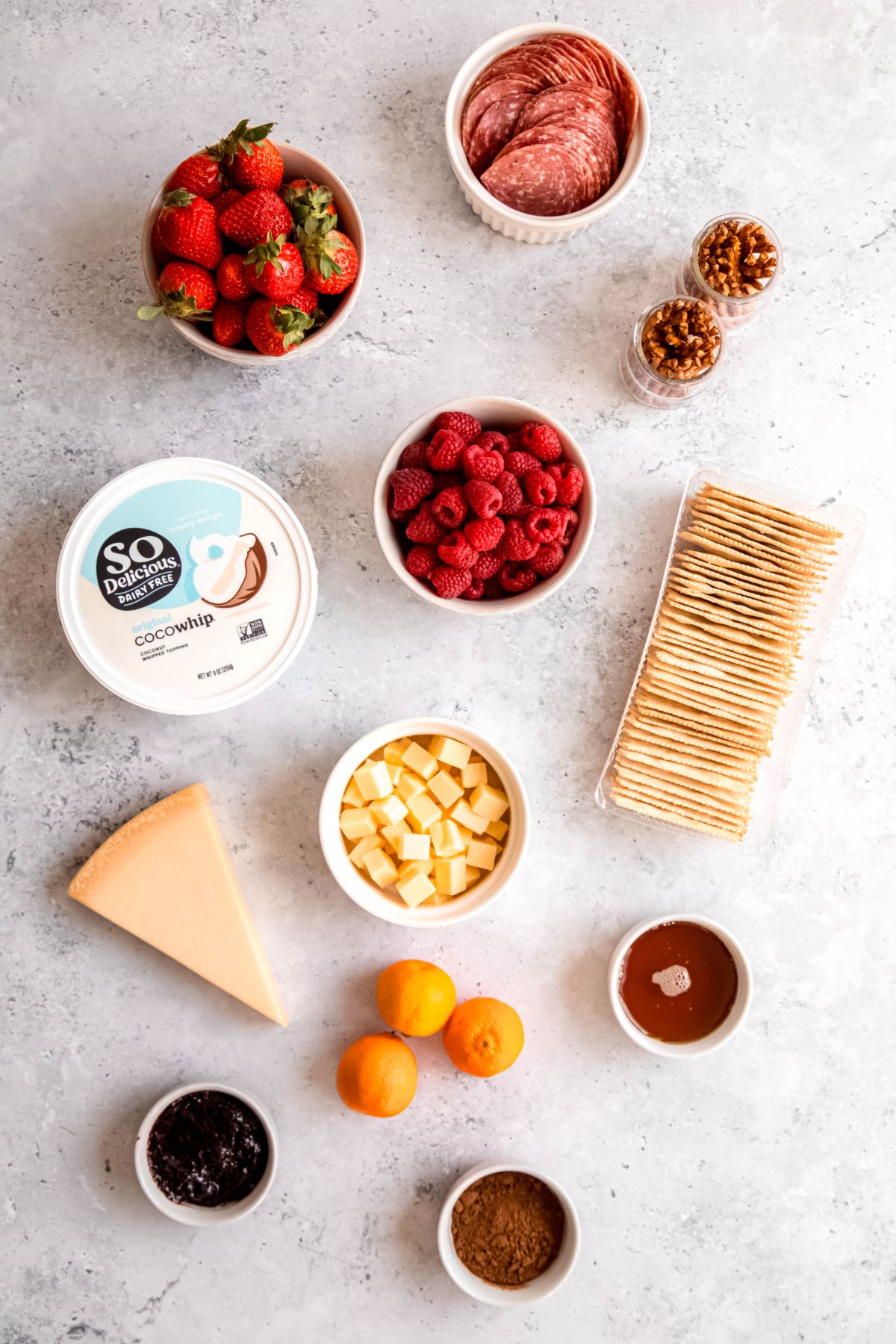 All the ingredients needed to make valentine's day charcuterie on the counter.