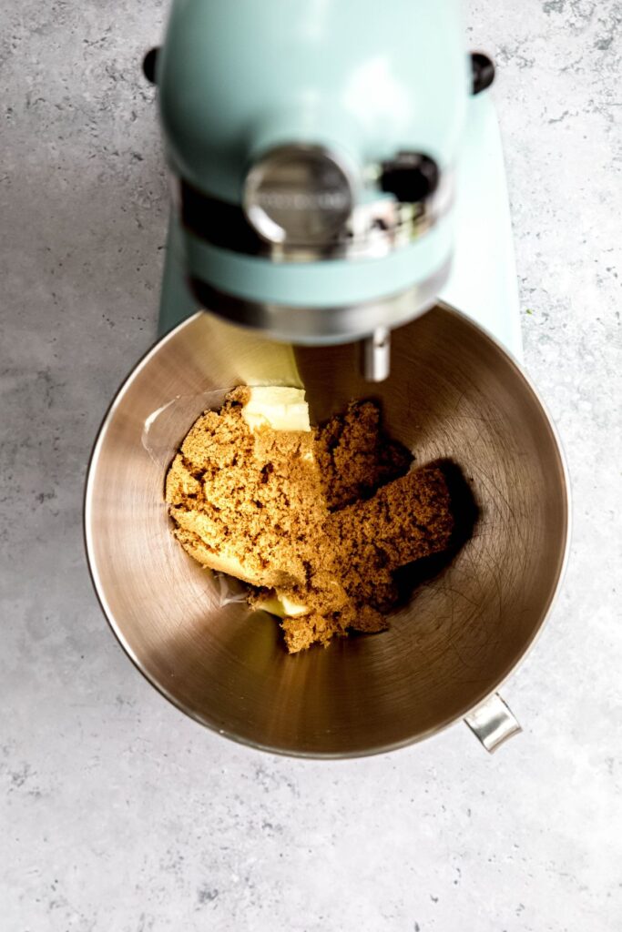 butter and brown sugar added to the bowl of a stand mixer.