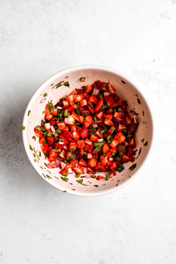 strawberry salsa in a bowl after mixing and macerating for 10 minutes.