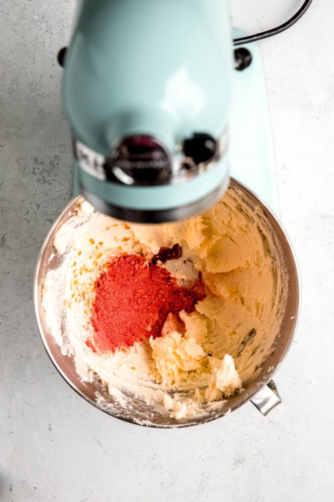 vanilla extract and strawberry powder added to the creamed butter.
