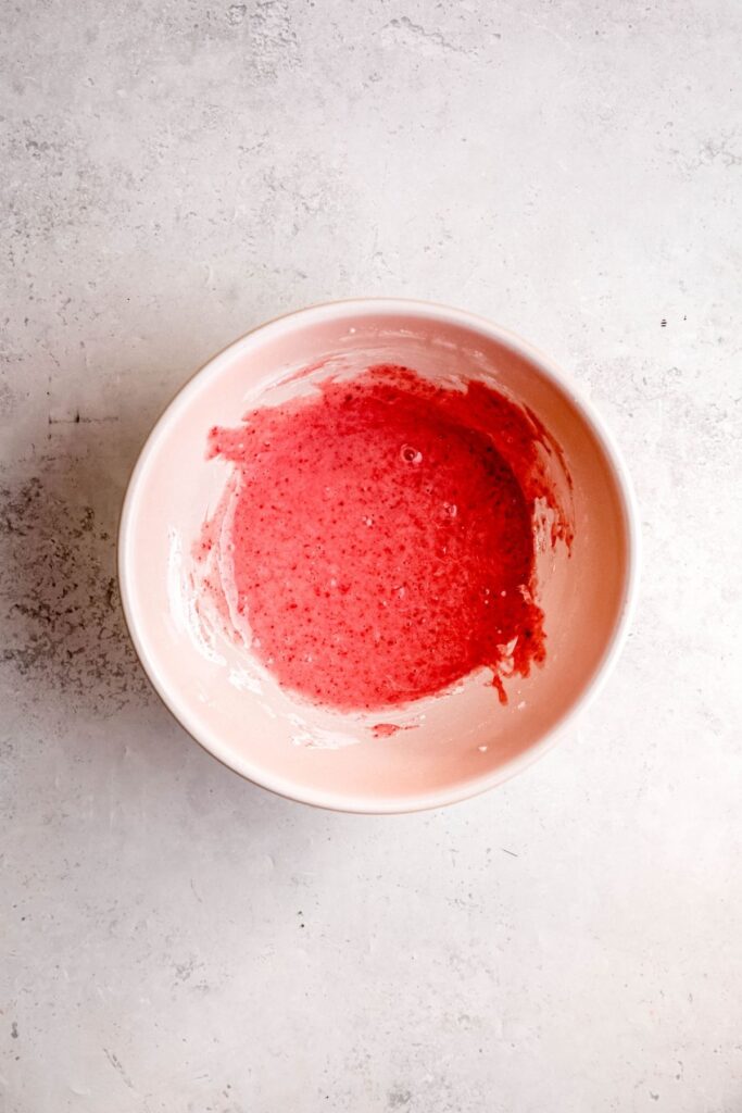 strawberry glaze after mixing in a mixing bowl.