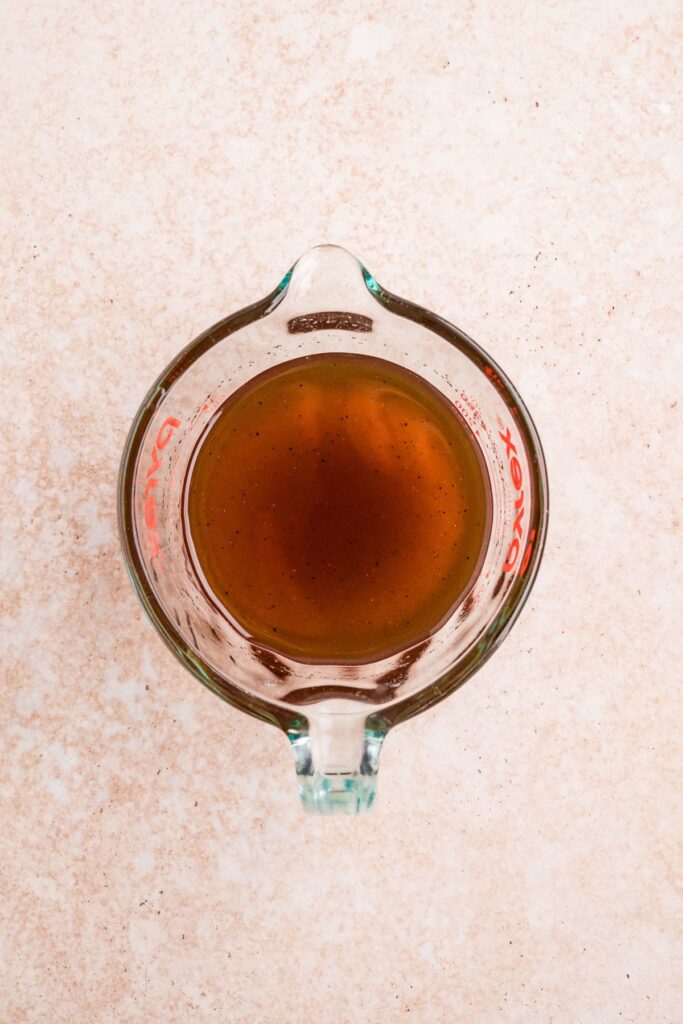honey mixture in a liquid measuring cup.
