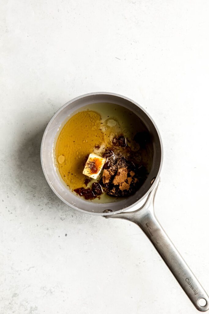 honey brown sugar glaze ingredients added to a small saucepan.