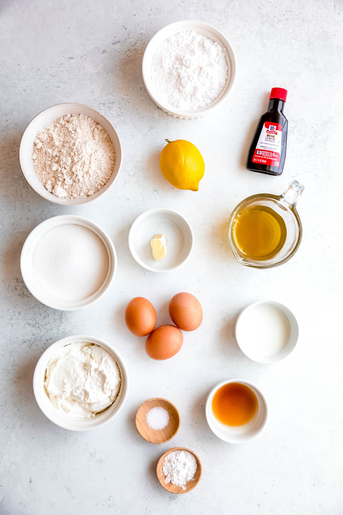 ingredients needed to make copycat starbucks iced lemon loaf cake recipe measured out on a white table.