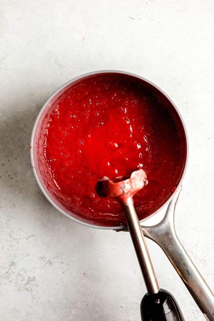 rhubarb sauce in the saucepan after removing from heat, adding vanilla extract and blending until smooth.