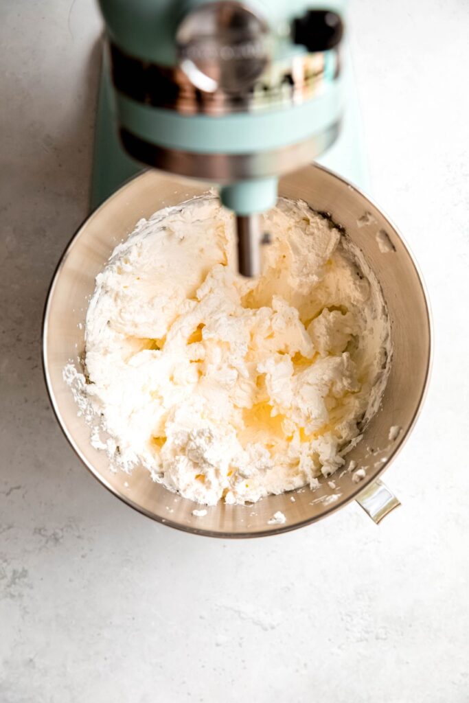 vanilla whipped cream in the bowl of a stand mixer.